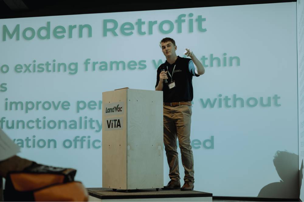 Expert-speaking-landvac-vita-event.jpg Expert presenting modern retrofit and insulation solutions during the LandVac VITA event.