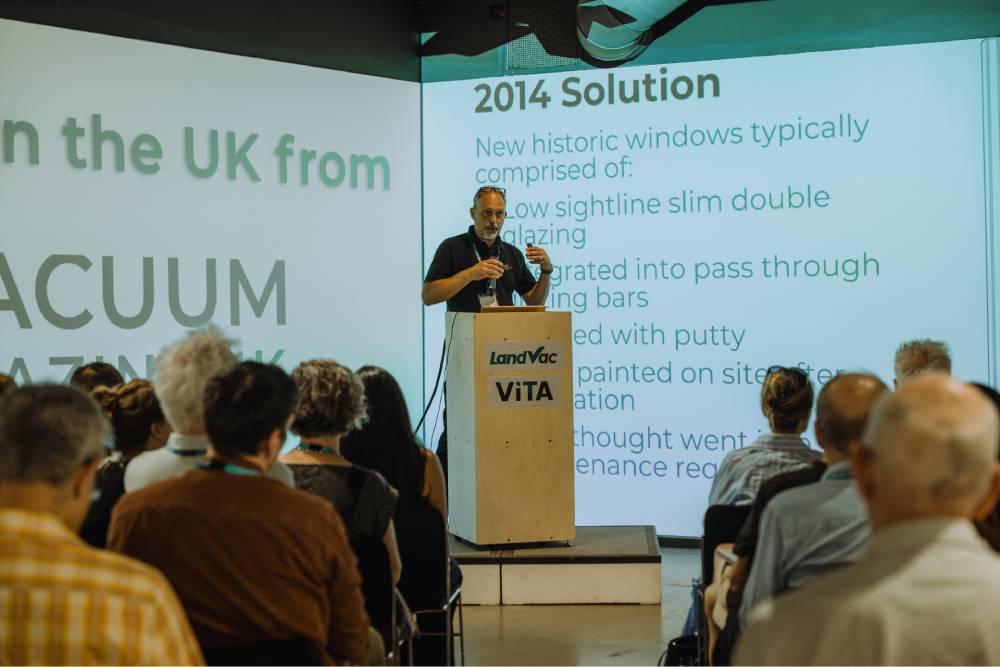 Expert-speaking-landvac-vita-event.jpg Expert presenting modern retrofit and insulation solutions during the LandVac VITA event.