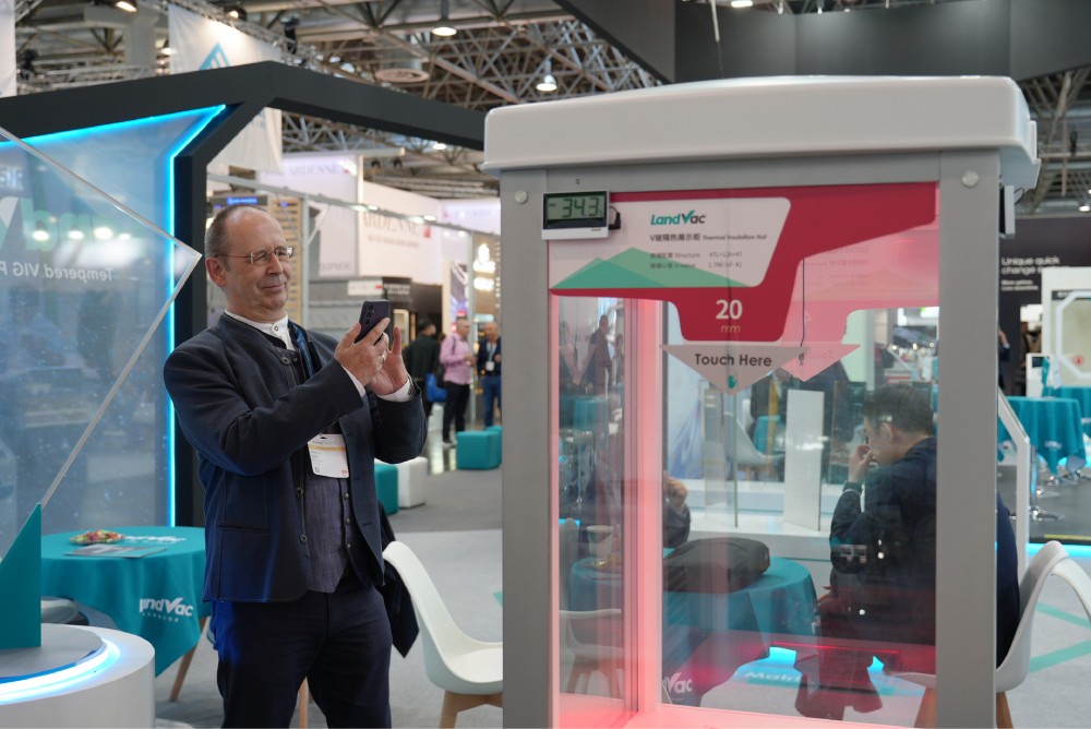 Exhibition visitors engaging with the LandGlass team at Glasstec 2026
