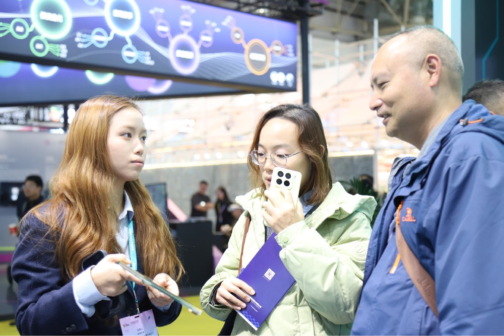 Visitors interacting with the LandVac team at FBC 2026